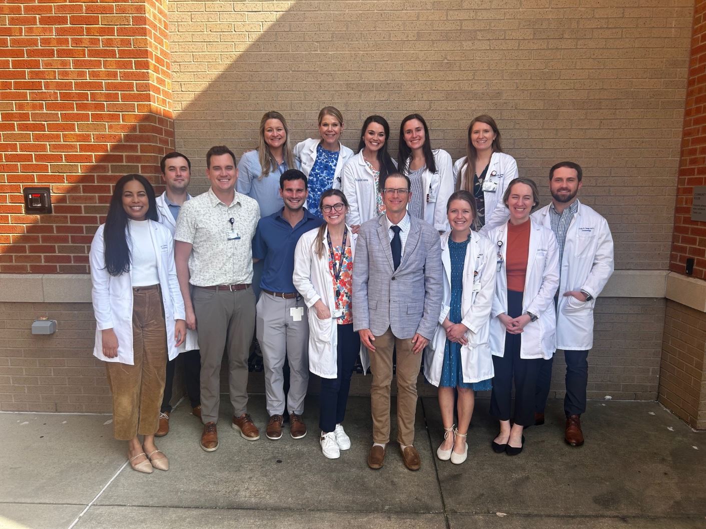 Dr. Matthew Keller, May Grand Rounds speaker, pictured with our residents.